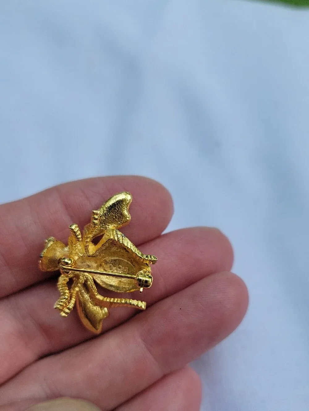 Vintage Joan Rivers Gold Bee Brooch with Red Crystals